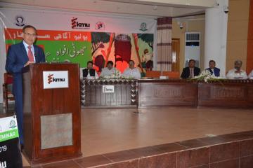 04.VC KMU Dr Arshad Javaid talking to Polio Agahi Seminar organized by KMU PHA,Secratary Health KP Dr Faruq Jamil along with others also sitting on stage1562666184.JPG
